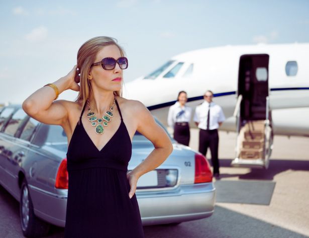 modern girl standing at airport with Limo